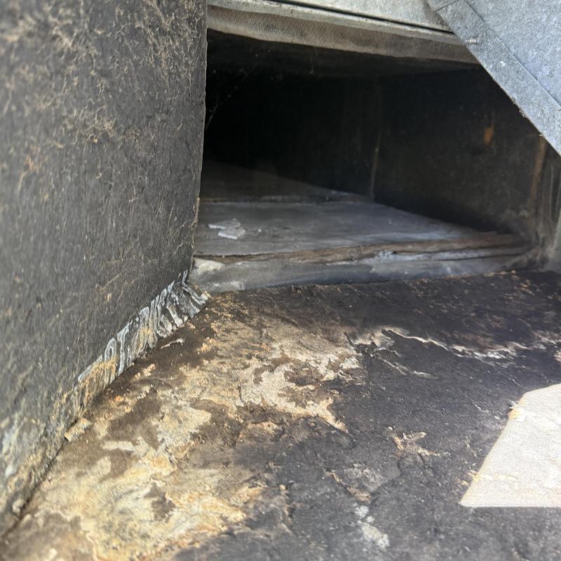 Ductwork interior showing damaged insulation and debris Ductwork interior showing damaged insulation and debris