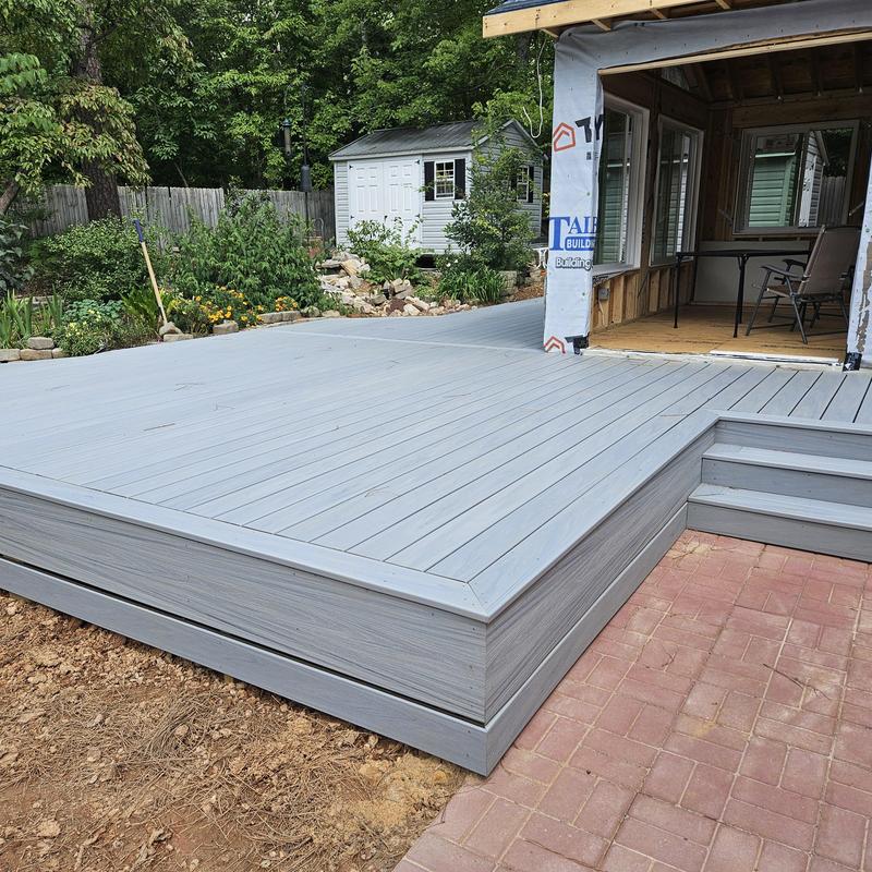 Composite deck addition with sunroom framing
