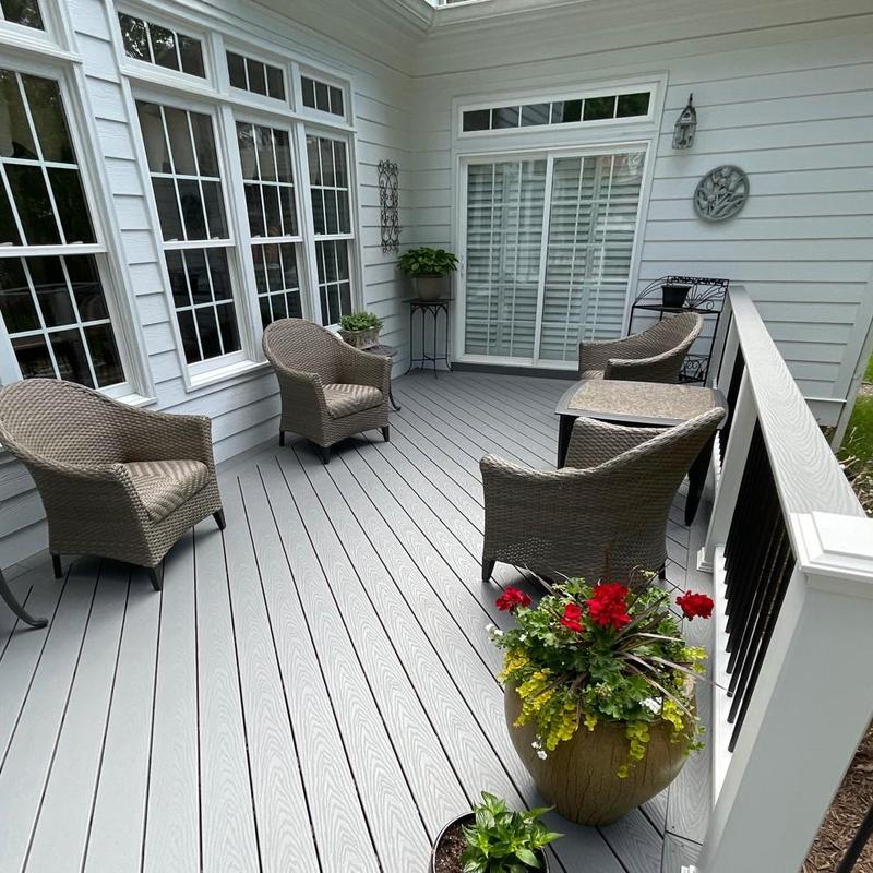 Composite deck with gray wood-grain and black balusters