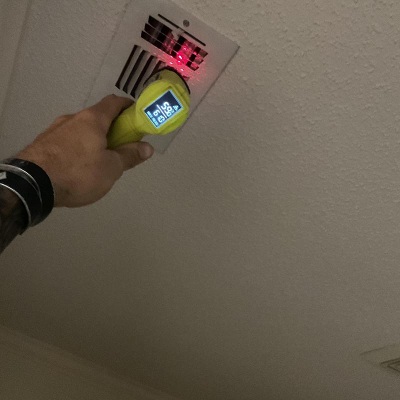 HVAC vent temperature testing with handheld meter