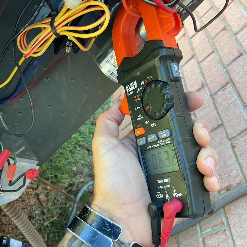 HVAC electrical connections tested with clamp meter