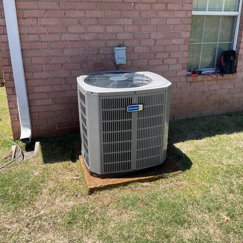 Central air conditioner unit with cleared condenser coil