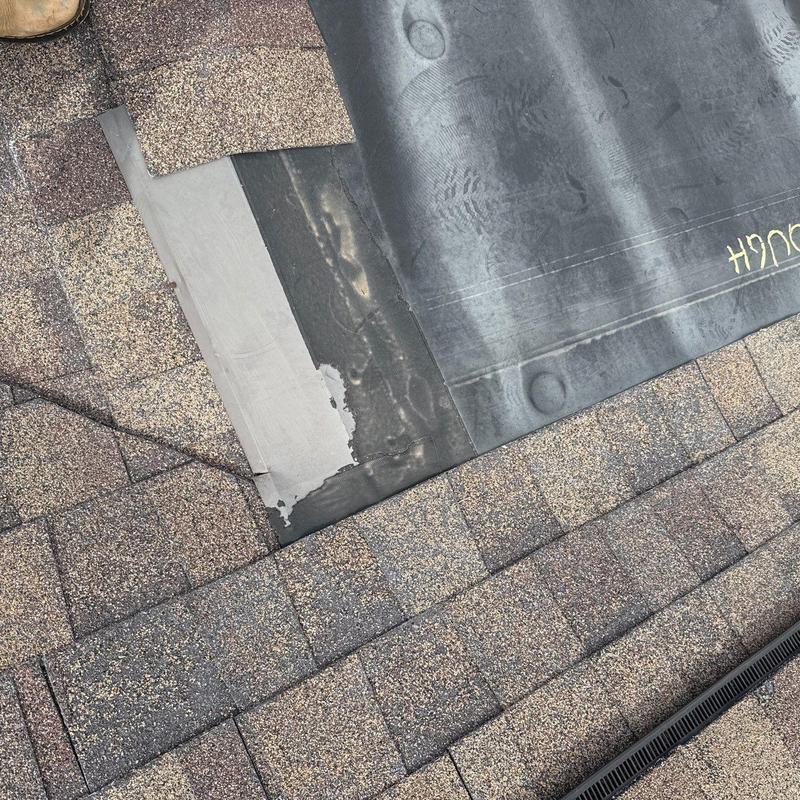 Roof flashing and underlayment with hail damage on shingles
