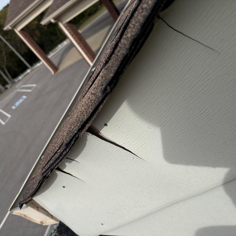 Roof edge flashing with hail damage and cracks