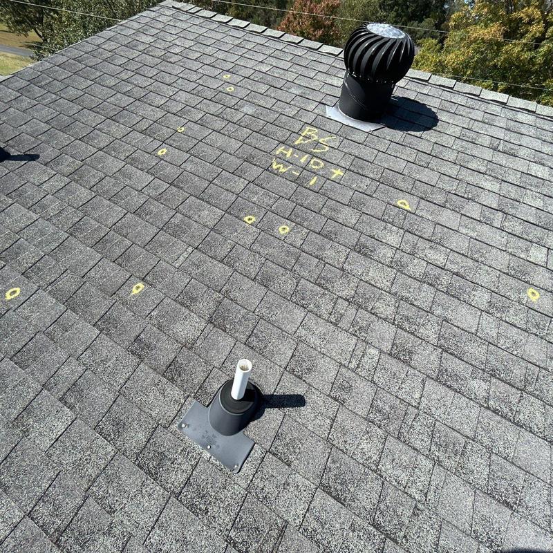 Asphalt shingle roof with hail damage markings
