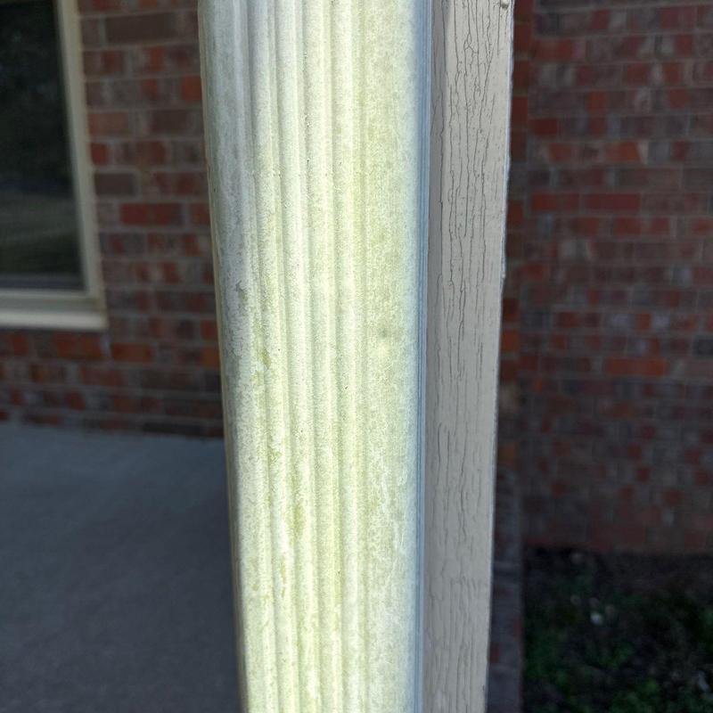 Downspout exterior with dirt and discoloration close-up