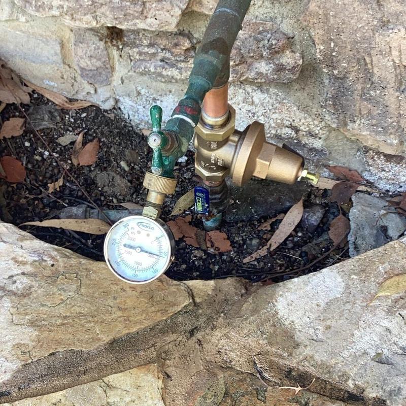 Water main pressure regulator with gauge and valve installation