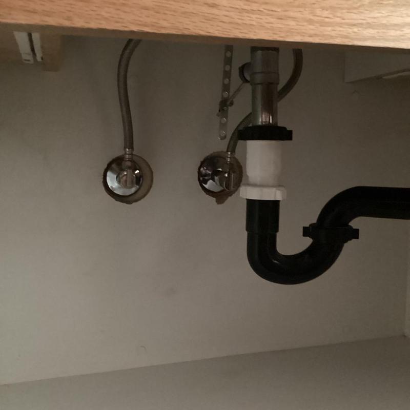 Angle stop valves and supply lines under sink