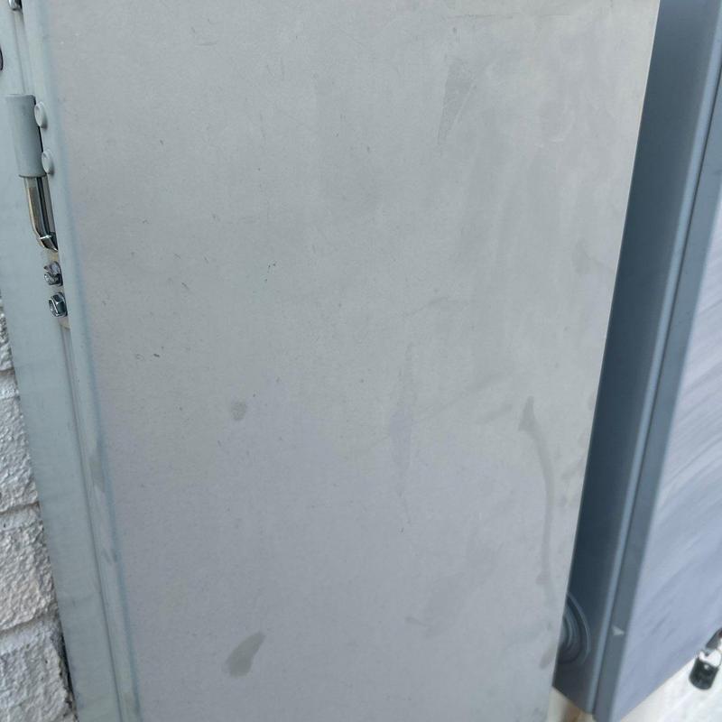 Electrical panel exterior with smudges and stains