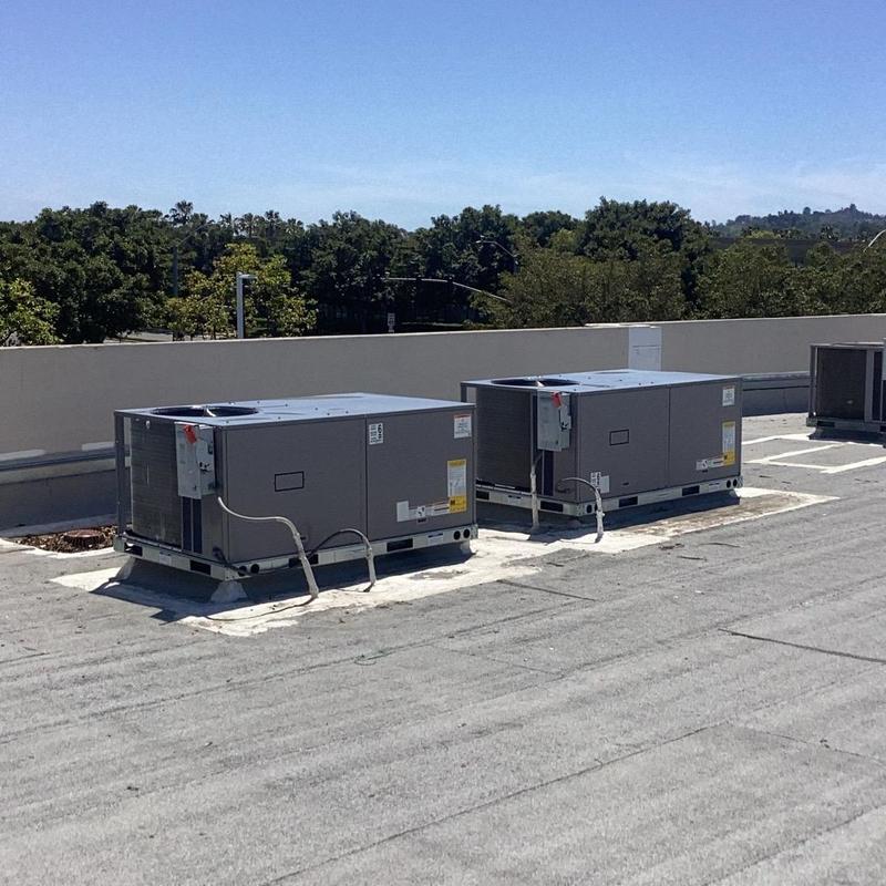 Commercial rooftop HVAC package units on flat roof Commercial rooftop HVAC package units on flat roof