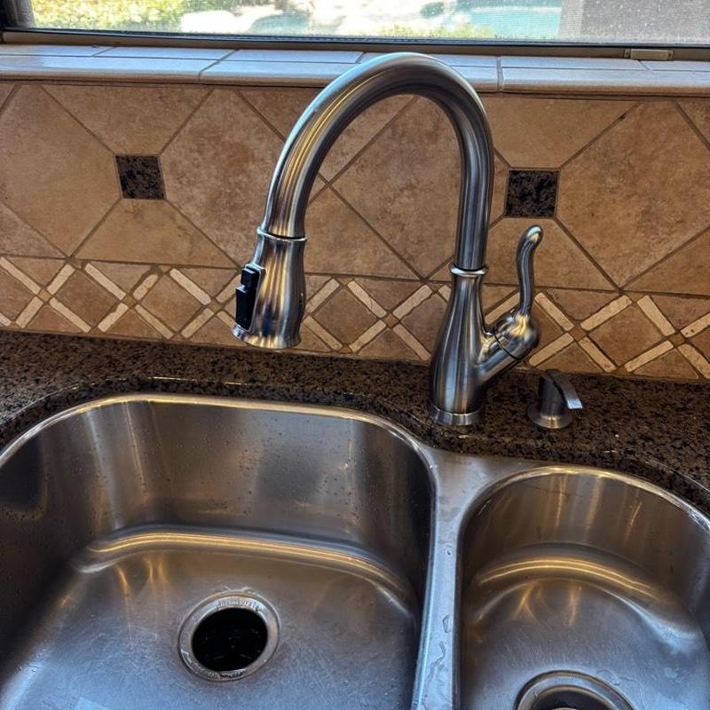 Delta kitchen faucet with sink and granite countertop