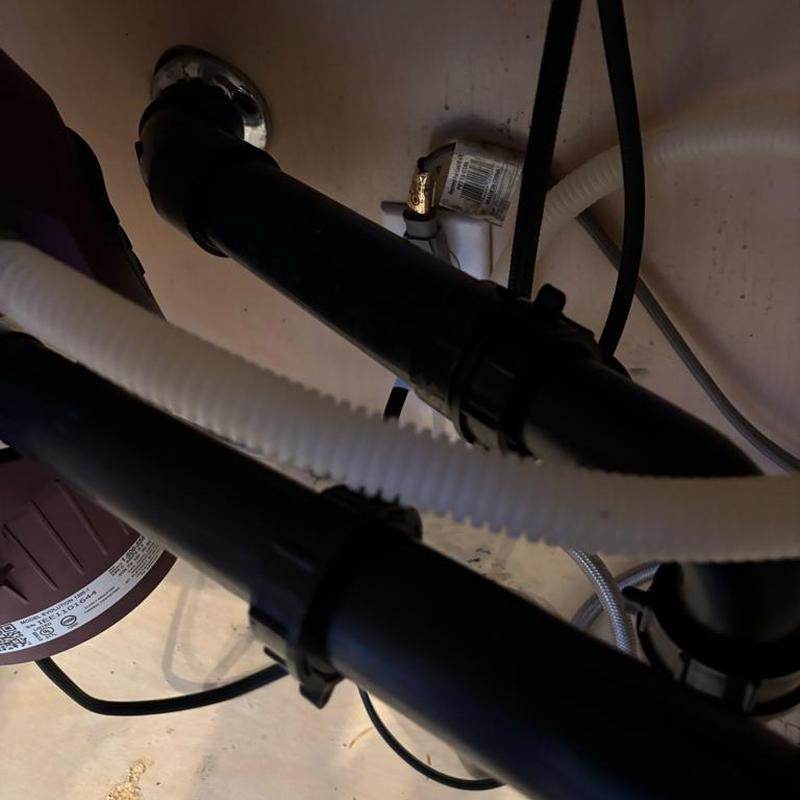 Kitchen sink drain piping and disposal installation under cabinet