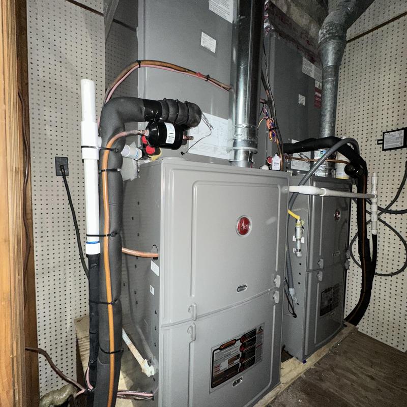 Rheem 14 SEER furnace system installed in utility room Rheem 14 SEER furnace system installed in utility room