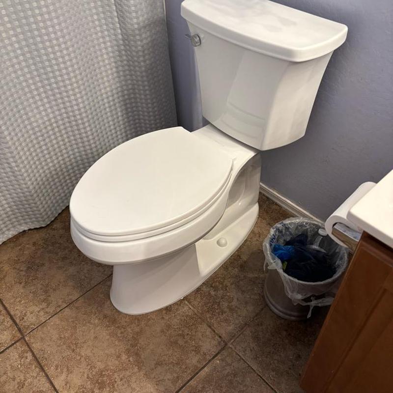 Kohler toilet installed with caulked base and angle stop