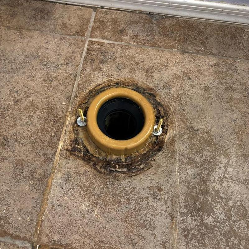 Toilet flange on tiled bathroom floor in Queen Creek, AZ