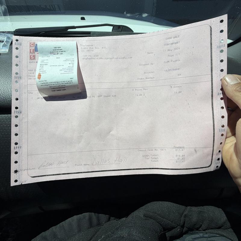 Electronic thermostat invoice held inside vehicle