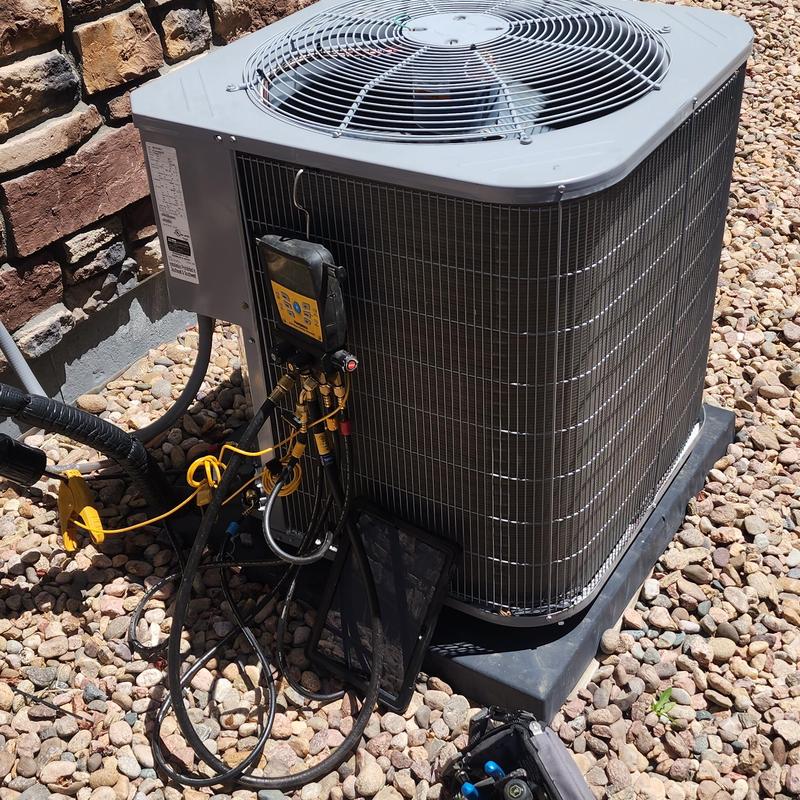 Carrier air conditioner with diagnostic gauges on gravel