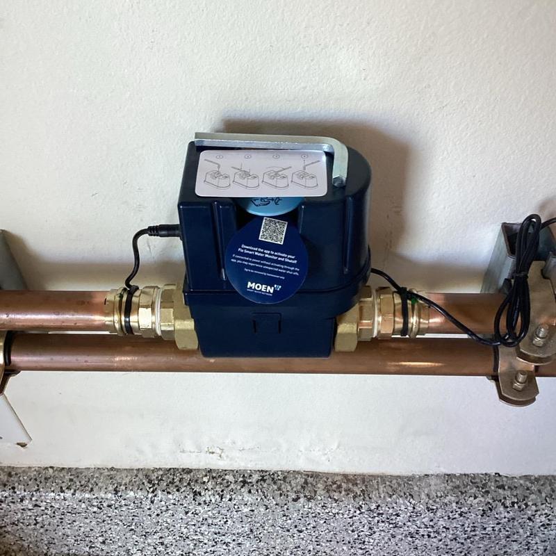 Moen Flo water monitoring system installed on pipe