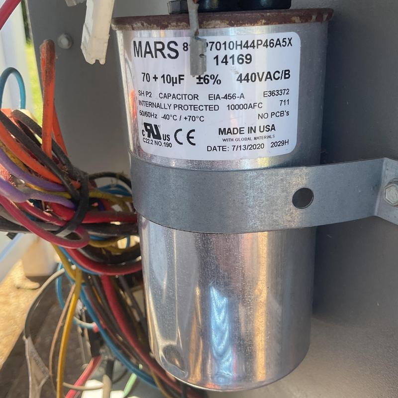 Air conditioner capacitor with wiring connections