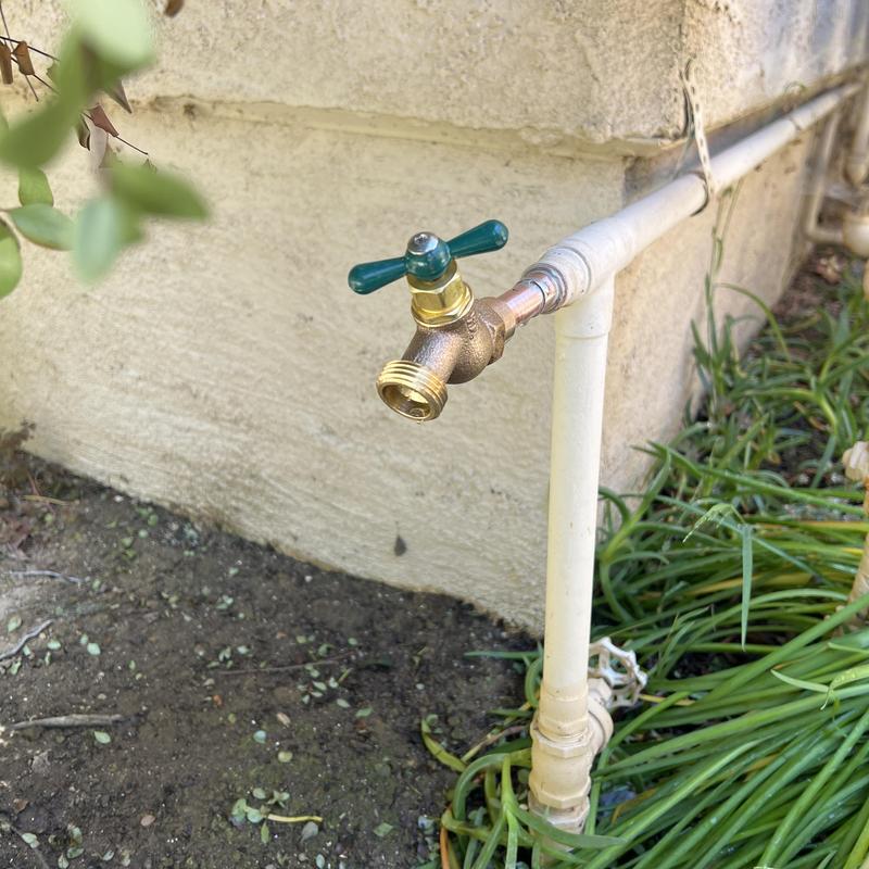 Copper hose bib and piping installation outdoors Copper hose bib and piping installation outdoors