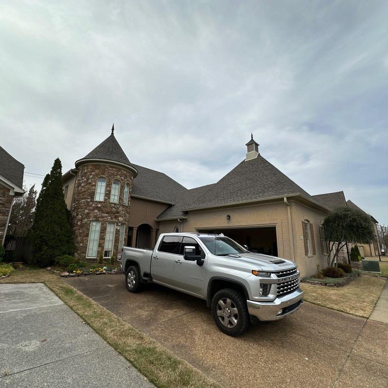 Turret style asphalt roof on residential home