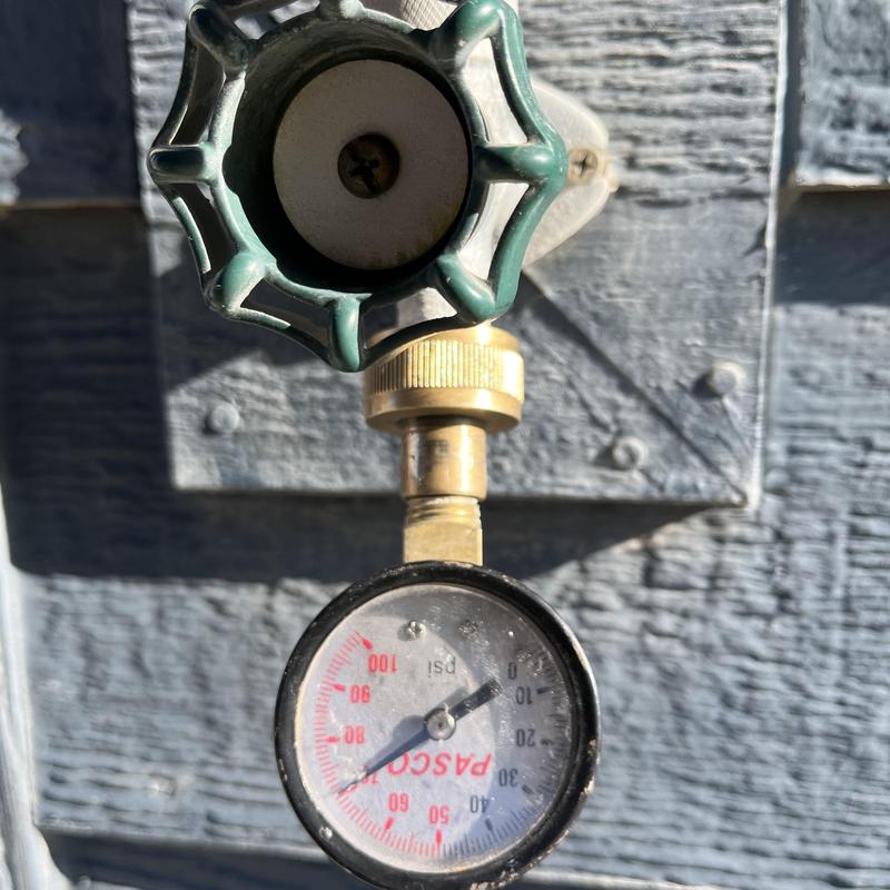 Water pressure gauge on outdoor hose bib valve