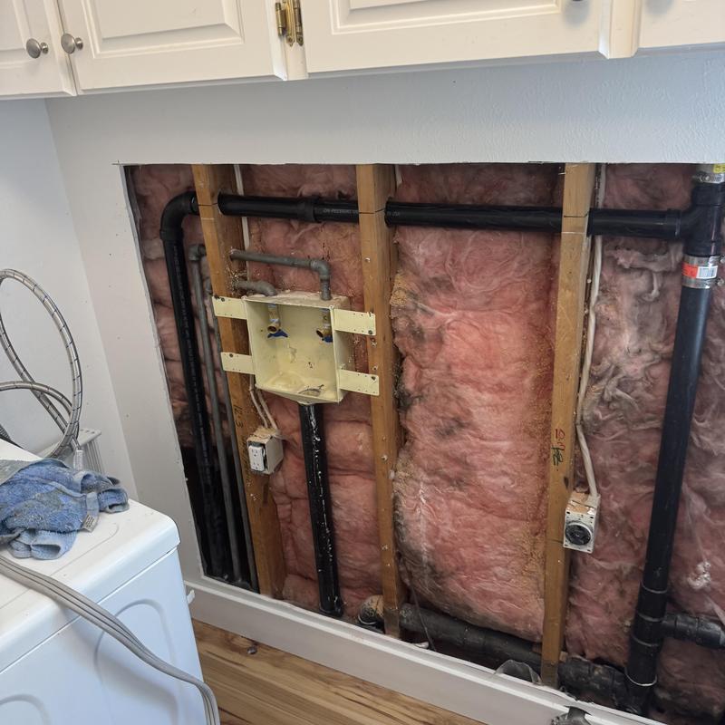 Tankless water heater condensate drain installation wall