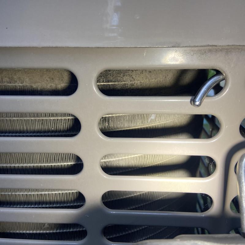HVAC condenser coil with metal grille and hook HVAC condenser coil with metal grille and hook