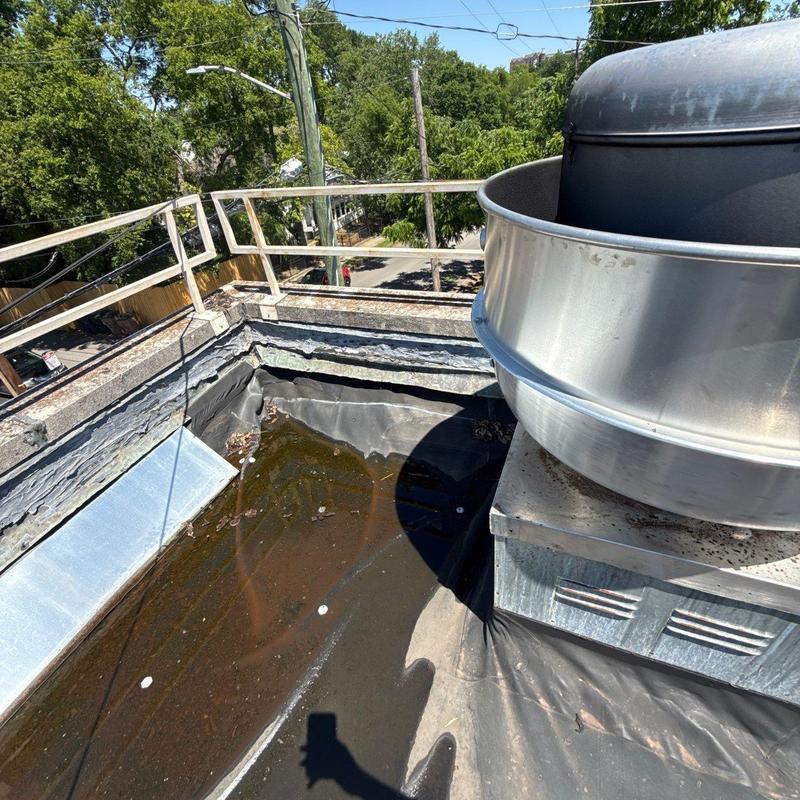 EPDM roof with standing water near ventilation unit