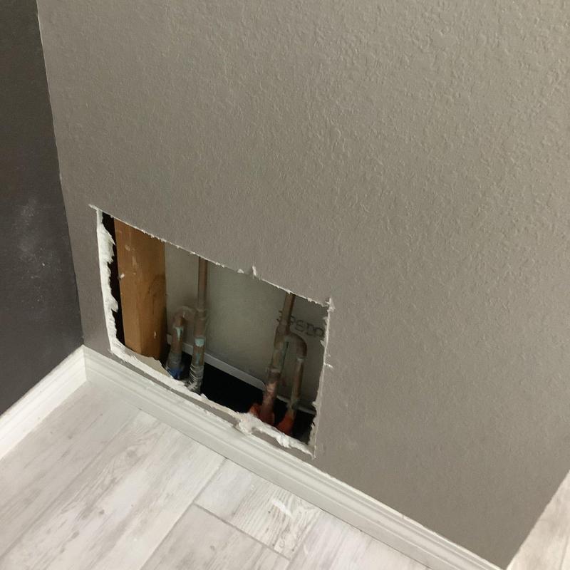Copper water pipes in wall cavity with open access panel