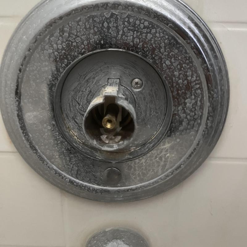 Moen Posi Temp shower valve stem exposed for cartridge replacement