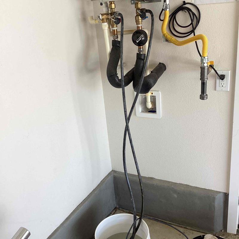 Tankless water heater flush setup with pump and valves
