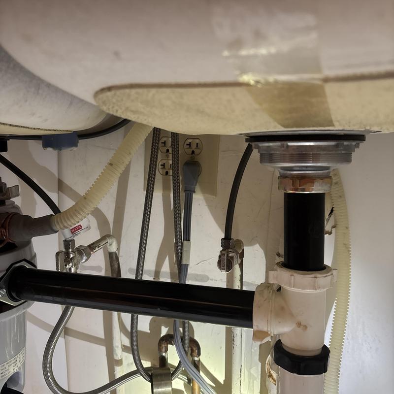 Kitchen sink drain pipes and water supply lines under cabinet Kitchen sink drain pipes and water supply lines under cabinet