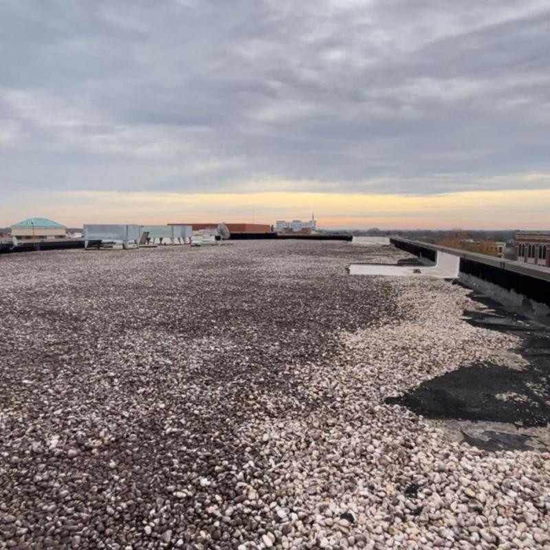 Gravel-covered commercial flat roof inspection in Spartanburg Gravel-covered commercial flat roof inspection in Spartanburg