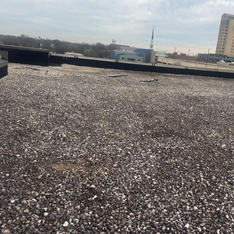 Gravel roofing surface on commercial high-rise building Gravel roofing surface on commercial high-rise building