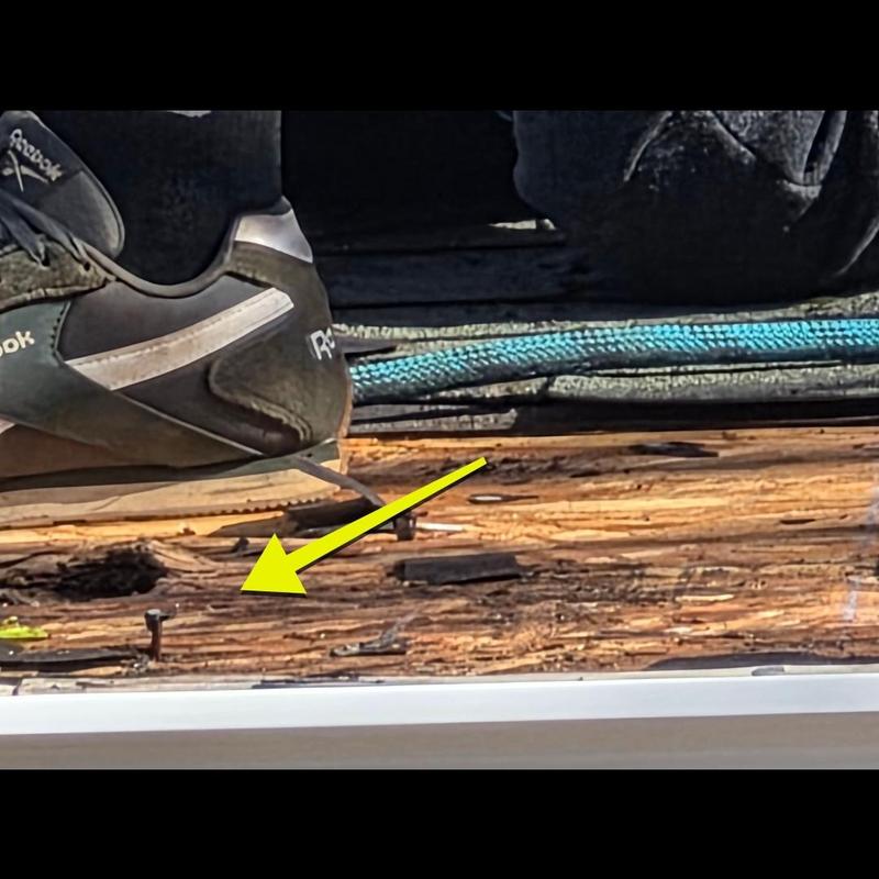Roof decking damage with exposed nails and wood rot Roof decking damage with exposed nails and wood rot