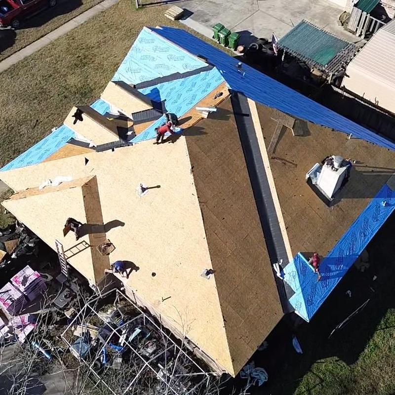 Roof decking installation with underlayment on house roof