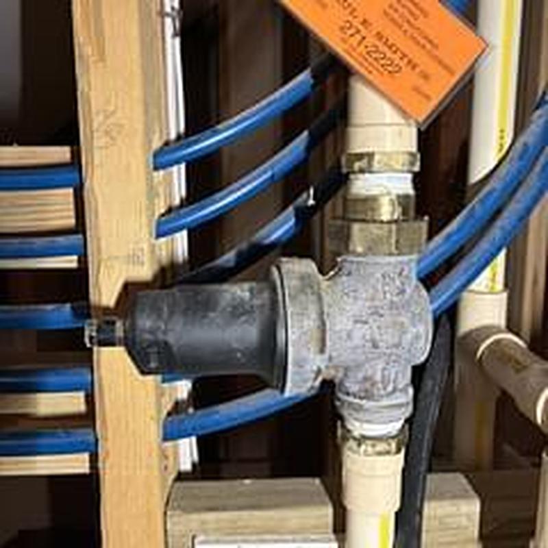 Pressure reducing valve with blue PEX pipes installed