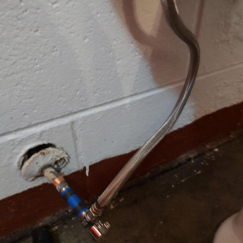 Shut off valve with braided supply line behind toilet Shut off valve with braided supply line behind toilet