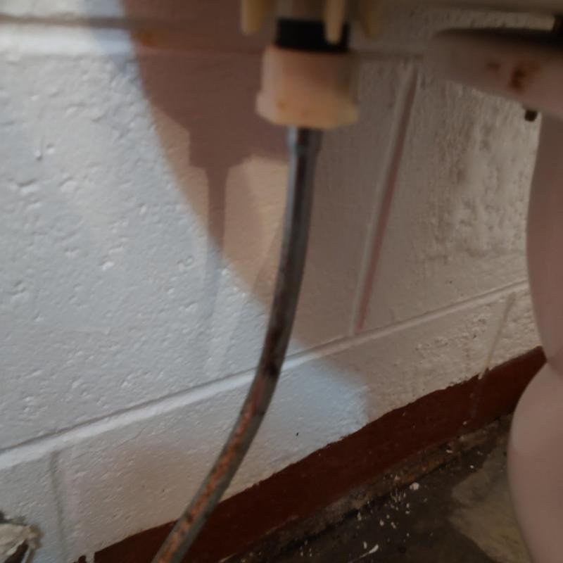 Toilet shut off valve with supply line in bathroom Toilet shut off valve with supply line in bathroom