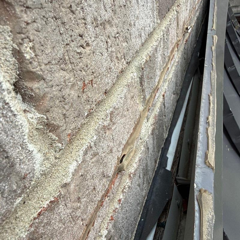 Roof flashing with deteriorated sealant and gaps