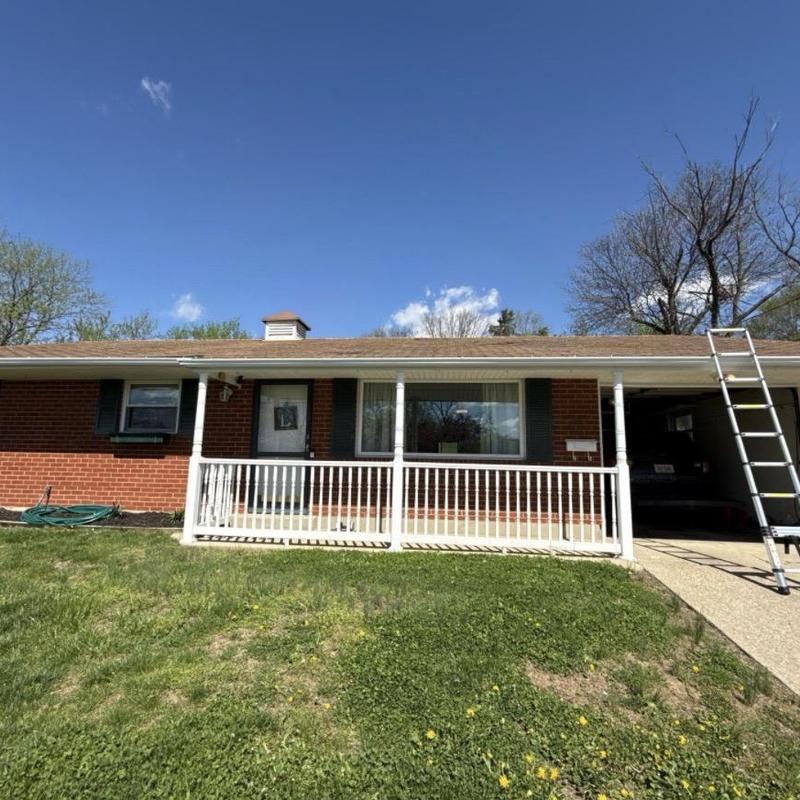 Asphalt shingle roof with ladder set up for inspection Asphalt shingle roof with ladder set up for inspection