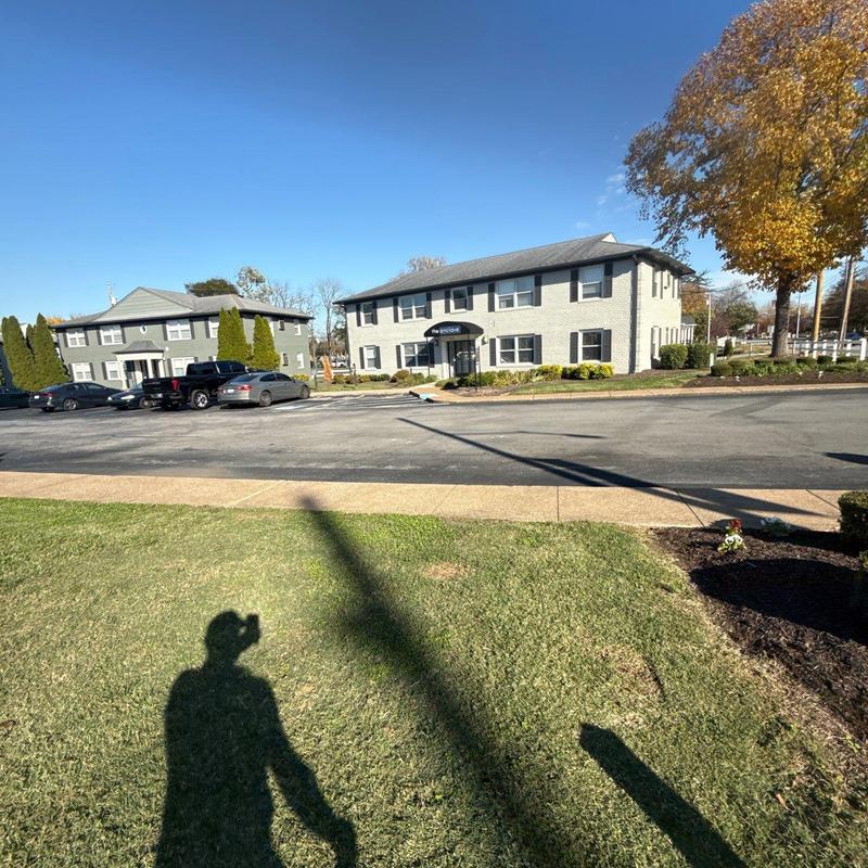 Multi-unit property roof with parking lot and landscaping