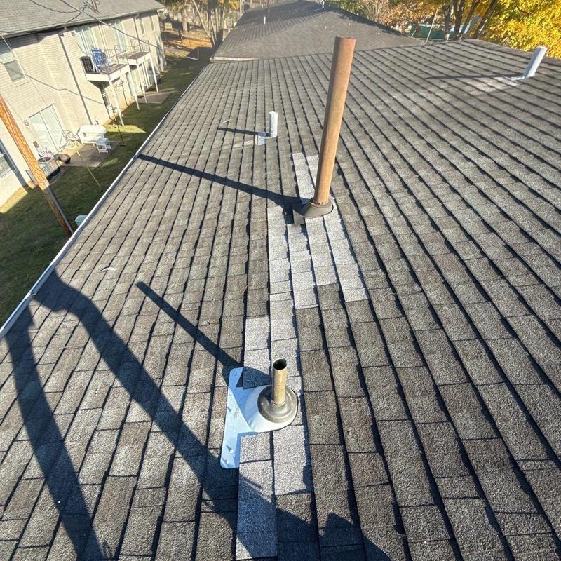 Roof vent flashing with patch repairs on shingle roof