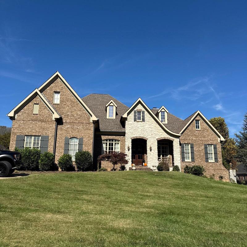 Asphalt shingle roof with hail damage inspection