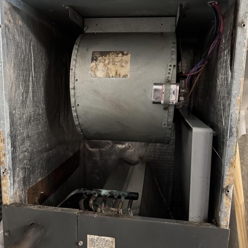HVAC blower wheel inside metal housing unit