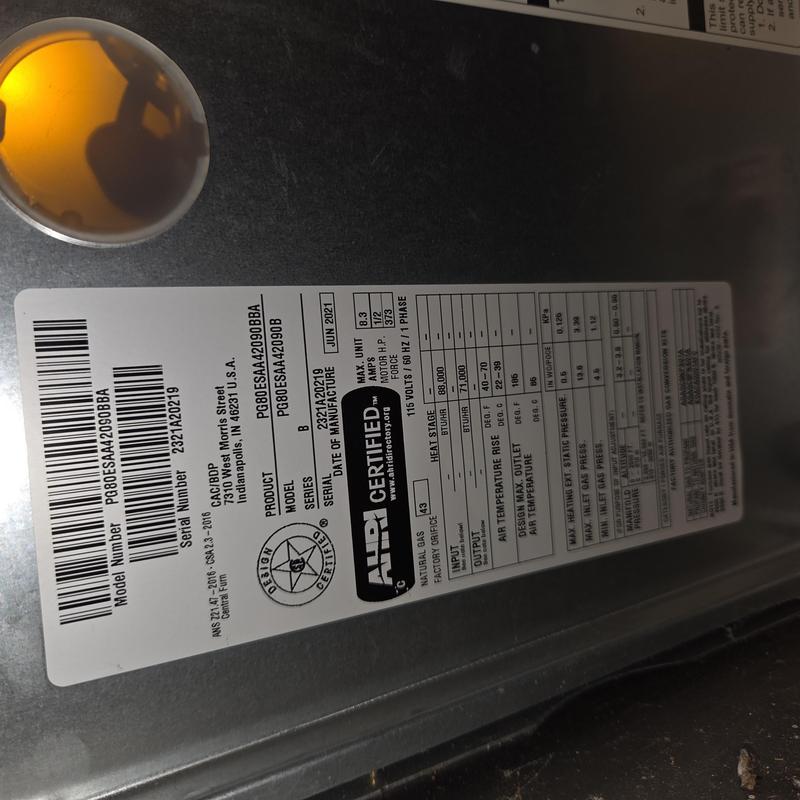 Furnace model label showing specs and certification