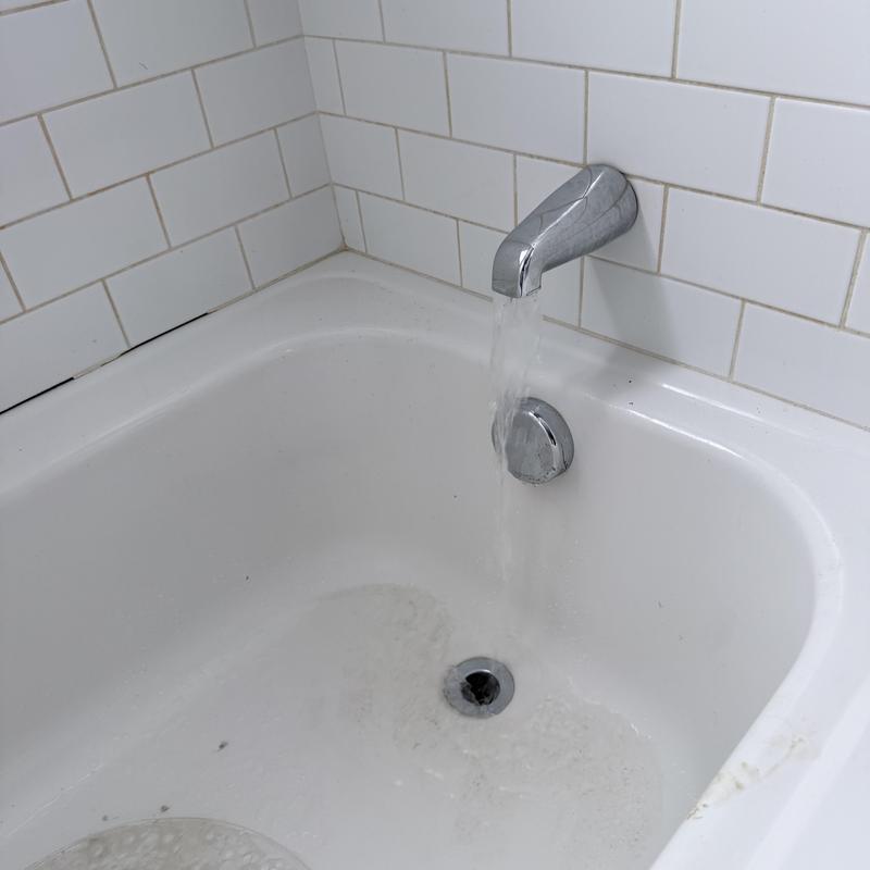 Bathtub drain and faucet with running water Bathtub drain and faucet with running water