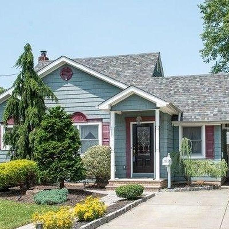 Shingle roof on residential home with landscaping Shingle roof on residential home with landscaping