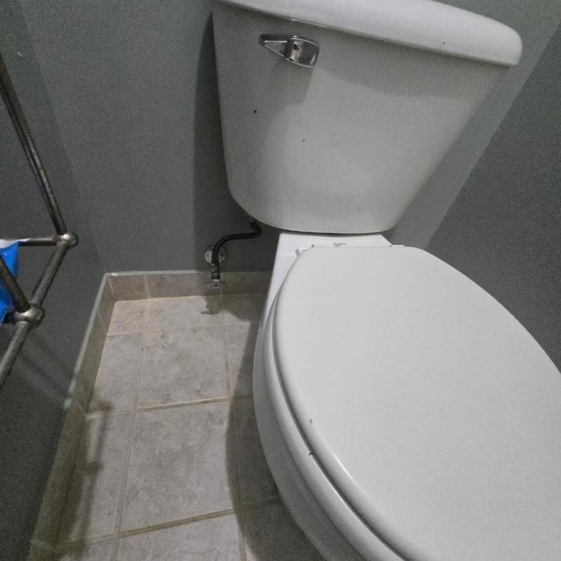 Toilet flange with new wax ring and supply line installed
